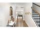 Inviting entryway with hardwood floors, white walls, and staircase at 1016 Matterhorn Dr, Fuquay Varina, NC 27526