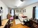 Bright bedroom with hardwood floors, a bed, a desk, and a window at 107 N Pearl St, Princeton, NC 27569