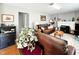 Comfortable living room featuring hardwood floors, a fireplace, grey walls and large, comfortable sofas at 107 N Pearl St, Princeton, NC 27569