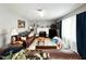 Comfortable living room featuring hardwood floors, a white painted fireplace, and grey walls at 107 N Pearl St, Princeton, NC 27569