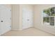 Well-lit bedroom with a double door closet and wall-to-wall carpeting at 1103 Weston Green Loop, Cary, NC 27513