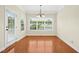 Bright dining area featuring hardwood floors, large windows, and light fixture at 1103 Weston Green Loop, Cary, NC 27513