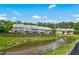Townhome complex with a water feature in front of the buildings at 1103 Weston Green Loop, Cary, NC 27513