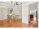 Foyer with hardwood floors leading to staircase and kitchen at 1103 Weston Green Loop, Cary, NC 27513
