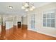 Bright living room featuring hardwood floors, recessed lighting, and a cozy fireplace at 1103 Weston Green Loop, Cary, NC 27513