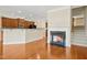 Well-lit living space with a fireplace, breakfast bar and access to the staircase at 1103 Weston Green Loop, Cary, NC 27513