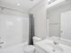 This well-lit bathroom features a shower-tub combo, vanity sink, and modern fixtures at 111 Grey Elm Trl, Durham, NC 27713