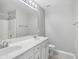 This bright bathroom features a double vanity, tile floors, and modern fixtures at 111 Grey Elm Trl, Durham, NC 27713