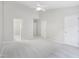 This light-filled bedroom has three doors, plush carpet, and neutral walls at 111 Grey Elm Trl, Durham, NC 27713