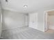 A spacious bedroom features neutral walls, plush carpet, closet, and an attached bathroom at 111 Grey Elm Trl, Durham, NC 27713