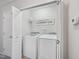 A functional laundry space features a washer, dryer, and custom laundry sign for added charm at 111 Grey Elm Trl, Durham, NC 27713