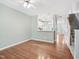 Hardwood floors and an open floorplan connecting the living room and kitchen at 111 Grey Elm Trl, Durham, NC 27713