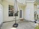 This charming patio has a concrete surface, a closed door, and open window at 111 Grey Elm Trl, Durham, NC 27713