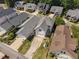 A suburban home featuring an attached garage, long driveways, and a well-maintained lawn at 112 Homegate Cir, Apex, NC 27502