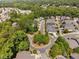 Aerial view of a residential neighborhood with tree-lined streets and well-maintained homes at 112 Homegate Cir, Apex, NC 27502