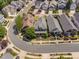 Aerial view of homes and a cul-de-sac with lush landscaping and well-maintained lawns at 112 Homegate Cir, Apex, NC 27502