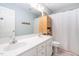 Bright bathroom with double vanity, shower curtain and bamboo shelf at 112 Homegate Cir, Apex, NC 27502