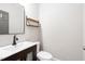 Bathroom features a modern vanity and a wood shelf at 112 Homegate Cir, Apex, NC 27502