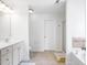 Bathroom features white cabinets, vanity, toilet, and tub at 112 Homegate Cir, Apex, NC 27502