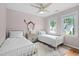 Bedroom features two beds, a mirror, and view of the outside at 112 Homegate Cir, Apex, NC 27502