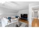 Upstairs bonus room featuring hardwood floors, large screen tv and comfortable seating at 112 Homegate Cir, Apex, NC 27502
