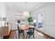 Dining room featuring wood flooring and an elegant chandelier at 112 Homegate Cir, Apex, NC 27502
