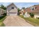 Wide driveway with a garage and a tent-covered play area in the yard at 112 Homegate Cir, Apex, NC 27502