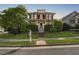 Charming two-story home with a welcoming front porch and professionally landscaped front yard at 112 Homegate Cir, Apex, NC 27502