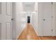Hallway with hardwood floors and white walls at 112 Homegate Cir, Apex, NC 27502