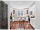 Bright kitchen featuring white cabinets, stainless steel appliances, and a stylish island at 112 Homegate Cir, Apex, NC 27502
