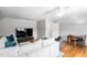 Living room area with large couch, dining area, and television at 112 Homegate Cir, Apex, NC 27502