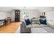 Living room area with large couch and window view at 112 Homegate Cir, Apex, NC 27502