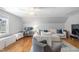 Bright living room with ceiling fan, couch and work space at 112 Homegate Cir, Apex, NC 27502