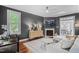 Cozy living room with a fireplace, stylish decor, and hardwood floors, perfect for relaxing at 112 Homegate Cir, Apex, NC 27502