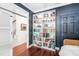 Living room featuring built-in bookshelves and dark blue painted walls at 112 Homegate Cir, Apex, NC 27502