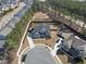 Aerial view showcasing a stunning home with mature trees and well-maintained yard in a suburban neighborhood at 113 Amberwing Ct, Holly Springs, NC 27540