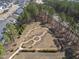 A lush community park is surrounded by a peaceful and heavily wooded area at 113 Amberwing Ct, Holly Springs, NC 27540