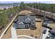 An aerial view of a meticulously landscaped home in a tranquil neighborhood near a forest at 113 Amberwing Ct, Holly Springs, NC 27540