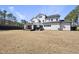 Expansive backyard with a covered patio, perfect for outdoor living and entertaining at 113 Amberwing Ct, Holly Springs, NC 27540