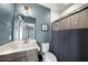 Stylish bathroom with modern fixtures, shower, and dark wood vanity for a sophisticated look at 113 Amberwing Ct, Holly Springs, NC 27540