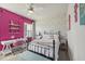 Charming bedroom featuring a brick accent wall and comfortable desk space at 113 Amberwing Ct, Holly Springs, NC 27540