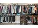 Spacious walk-in closet with ample hanging space and shoe storage at 113 Amberwing Ct, Holly Springs, NC 27540