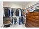 Well-organized walk-in closet with built-in shelves and ample storage space for clothes and accessories at 113 Amberwing Ct, Holly Springs, NC 27540