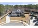 Beautiful two-story home with a manicured lawn, complemented by a stylish mix of siding and brick exterior at 113 Amberwing Ct, Holly Springs, NC 27540