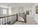 Hallway showcasing an ornate staircase and views to other rooms at 113 Amberwing Ct, Holly Springs, NC 27540