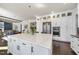 Spacious kitchen featuring a large island with a light countertop at 113 Amberwing Ct, Holly Springs, NC 27540