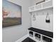 Well-appointed mudroom offering built-in storage, bench, and hooks for convenient organization at 113 Amberwing Ct, Holly Springs, NC 27540
