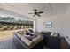 Covered patio with comfortable seating, perfect for enjoying the backyard view at 113 Amberwing Ct, Holly Springs, NC 27540