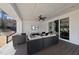 Covered patio with comfortable seating, perfect for enjoying the backyard view at 113 Amberwing Ct, Holly Springs, NC 27540