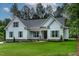 Well-manicured front lawn complements this charming home with light blue siding and green shutters at 1218 Red Cedar Ct, Youngsville, NC 27596